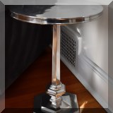 F04. 2 Nickel finish round side tables. 24"h x 18"w 
